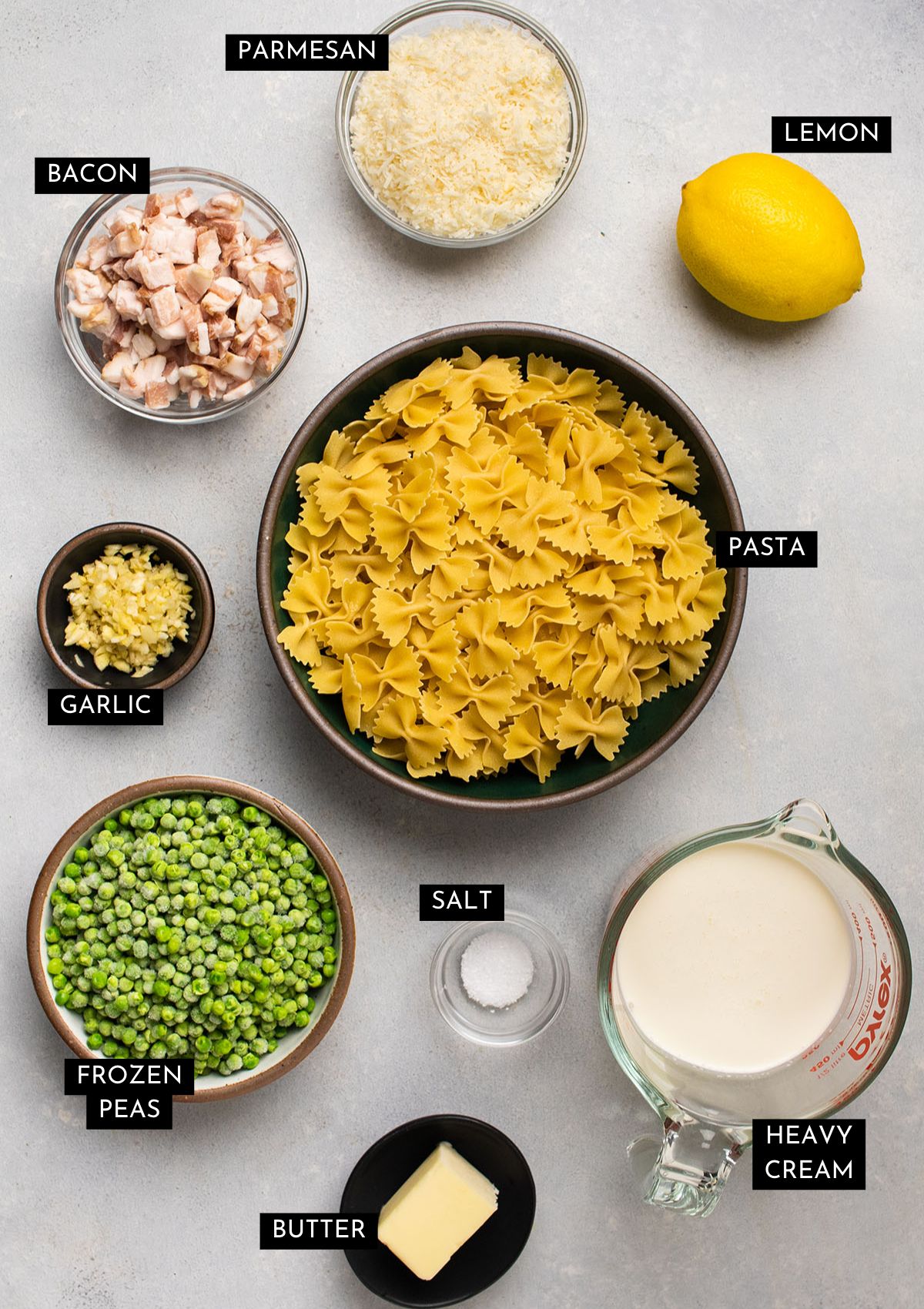 Pasta ingredients organized into individual bowls.